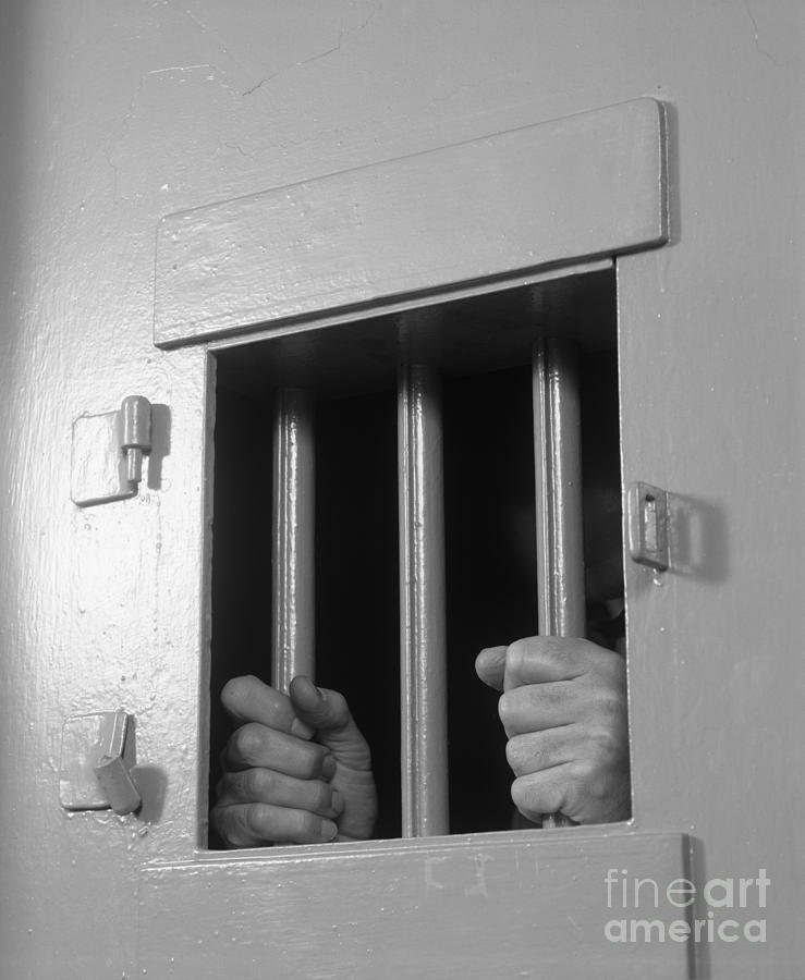 1980s Photograph - Prisoners Hands Gripping Bars, C.1980s by B. Taylor/ClassicStock