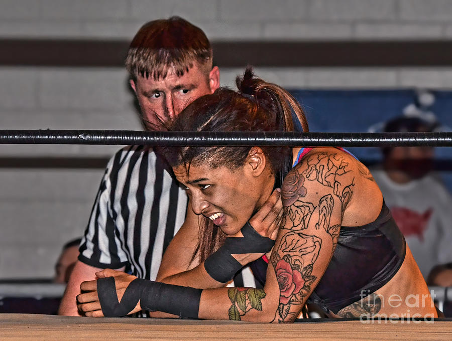 Pro Wrestler Nicole Savoy Being Tended to by Referee Sparkey Ballard  Photograph by Jim Fitzpatrick