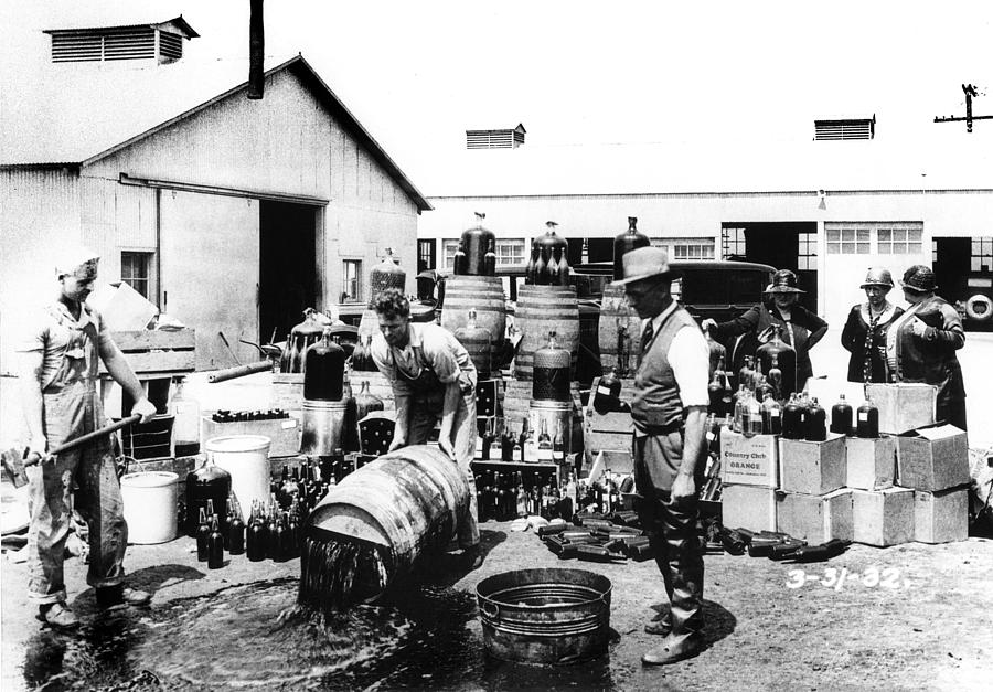 Prohibition - Dumping the Alcohol Photograph by Bill Cannon