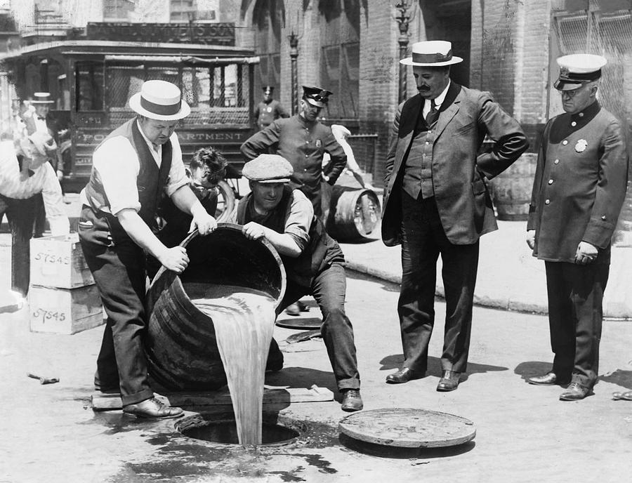 Prohibition - Pouring Beer Down the Drain Photograph by Bill Cannon