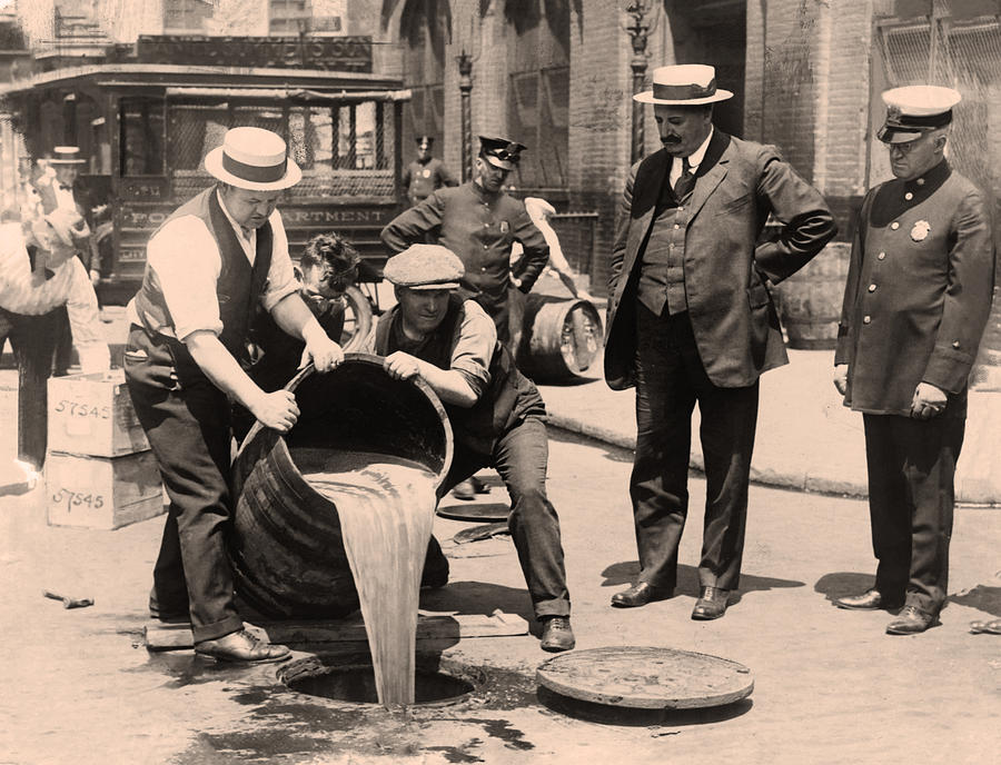 Prohibition - Pouring Beer Down the Drain in Sepia Photograph by Bill Cannon