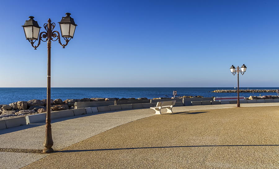Promenade near the sea, Saintes-Maries-de-la-mer, France Photograph by ...