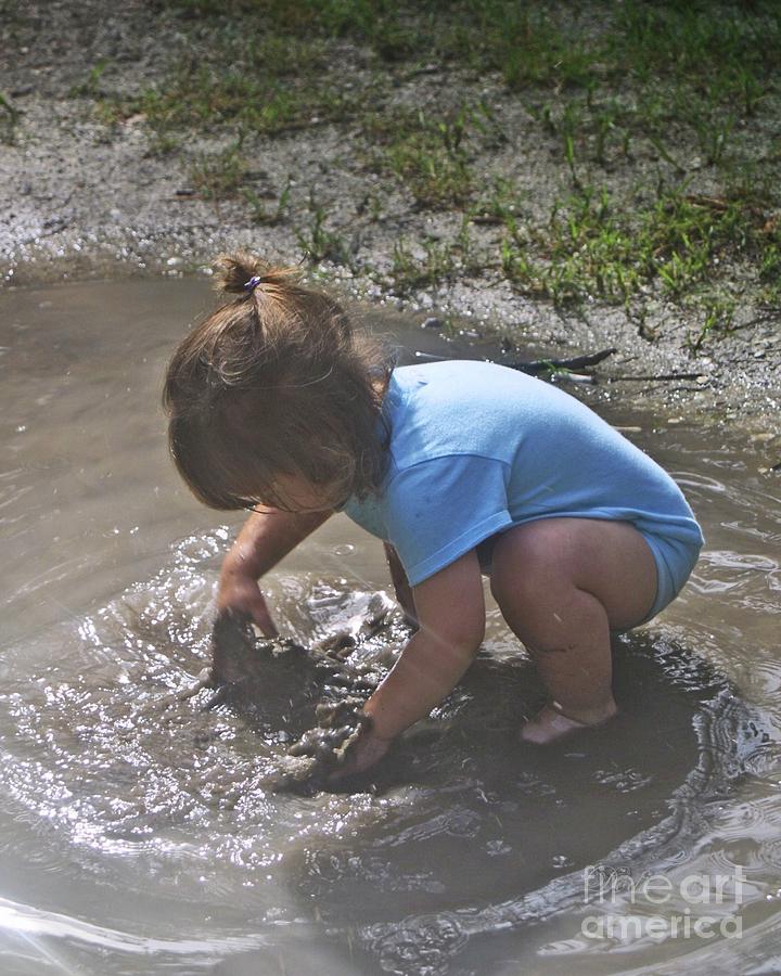 Puddles and kids Photograph by Dodie Ulery