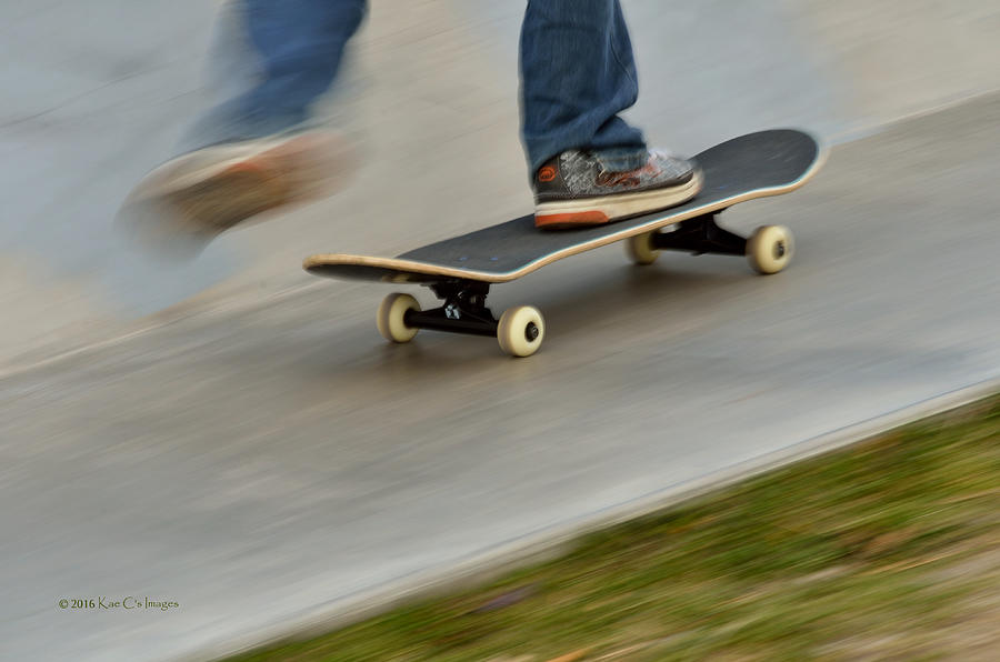 Pushing Off on a Skateboard Photograph by Kae Cheatham