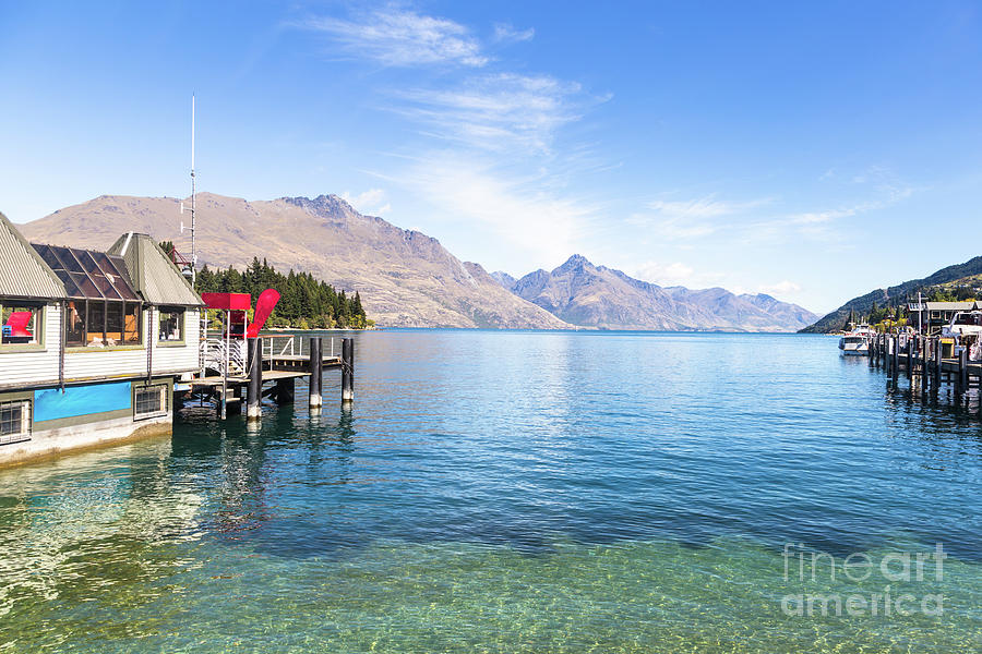 Queenstown jetty on lake Wakatipu in New Zealand Photograph by Didier Marti