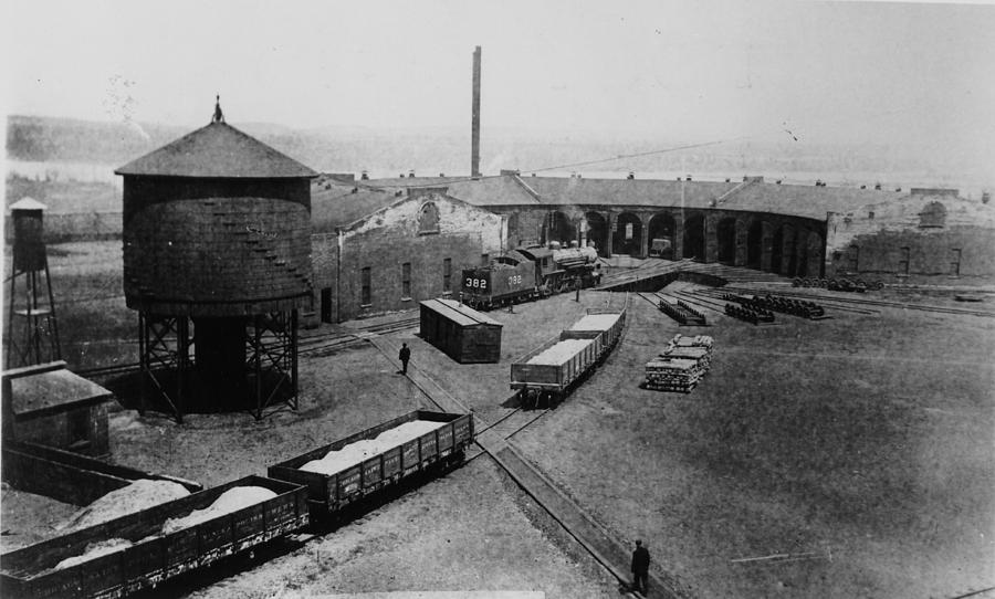 Railroad Yard With Water Tower and Gravel Trucks Photograph by Chicago and North Western Historical Society