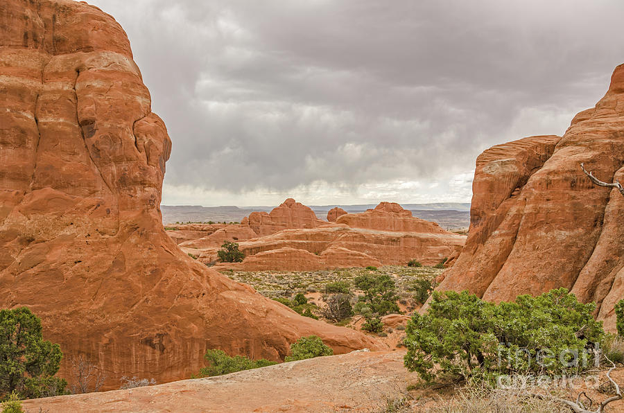 Rain in the Distance at Arches Photograph by Sue Smith