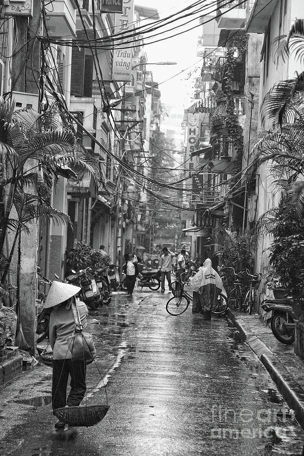 Black White Photograph - Rain Streets of Hanoi  by Chuck Kuhn