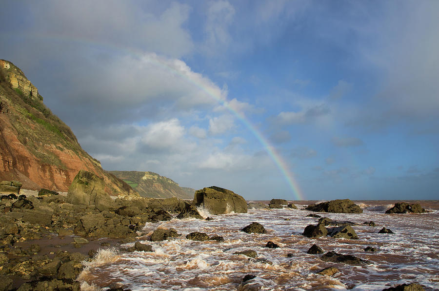 Rainbow over Dunscombe Cliff Photograph by Pete Hemington