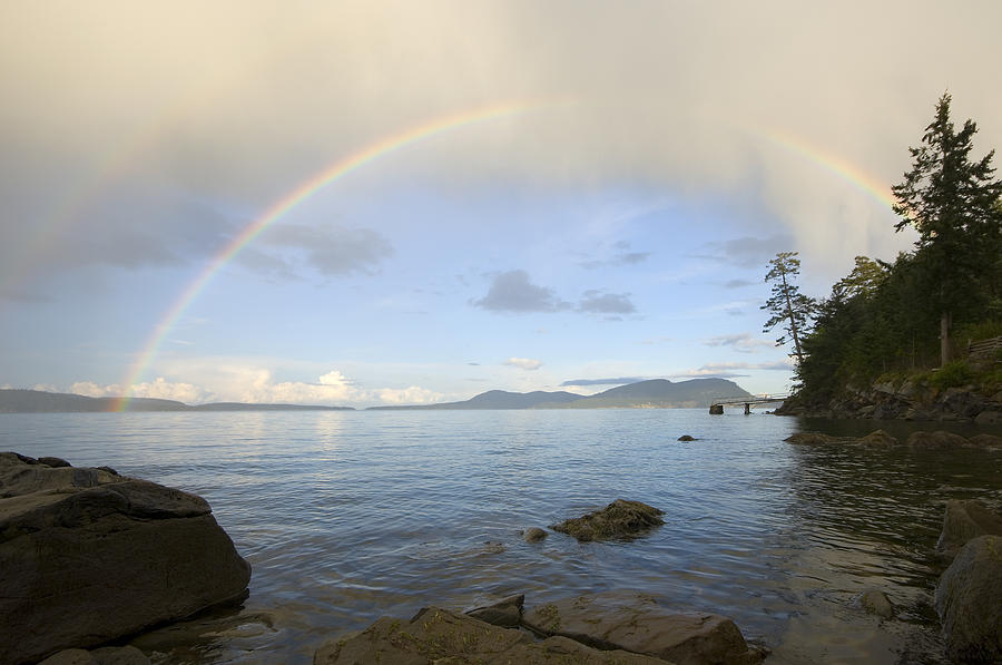 Rainbow over Saturna Island Photograph by Kevin Oke