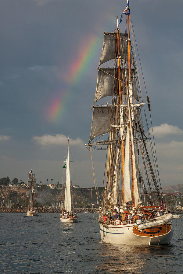 Rainbow over tall ships Photograph by Cliff Wassmann