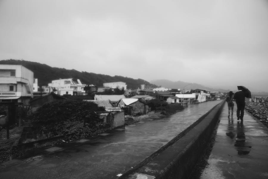 Black And White Photograph - Rainy Walk on a Seawall by Cynthia Fazekas