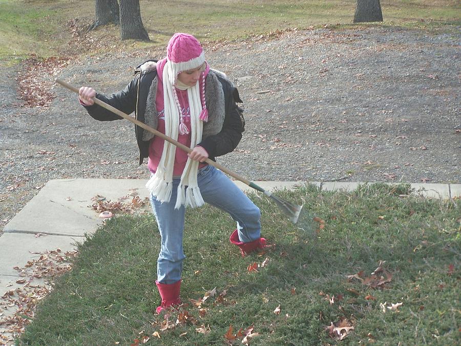 Young Lady Photograph - Raking Leaves in November by Lila Mattison
