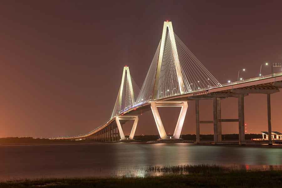 Ravenel Bridge Glowing In The Darkness of Charleston SC Photograph by Willie Harper