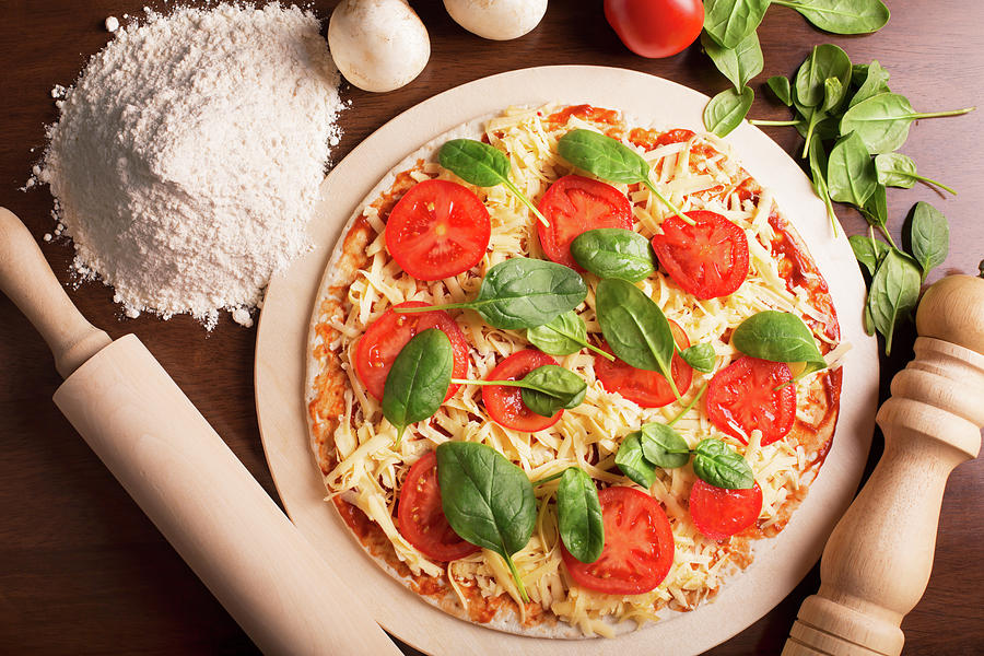 Raw Italian Pizza With Tomato And Spinach Photograph
