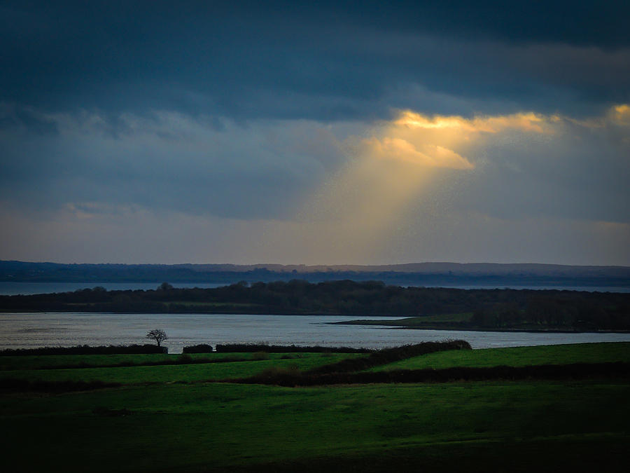 Rays of Hope  over Irelands Shannon Estuary Photograph by James Truett