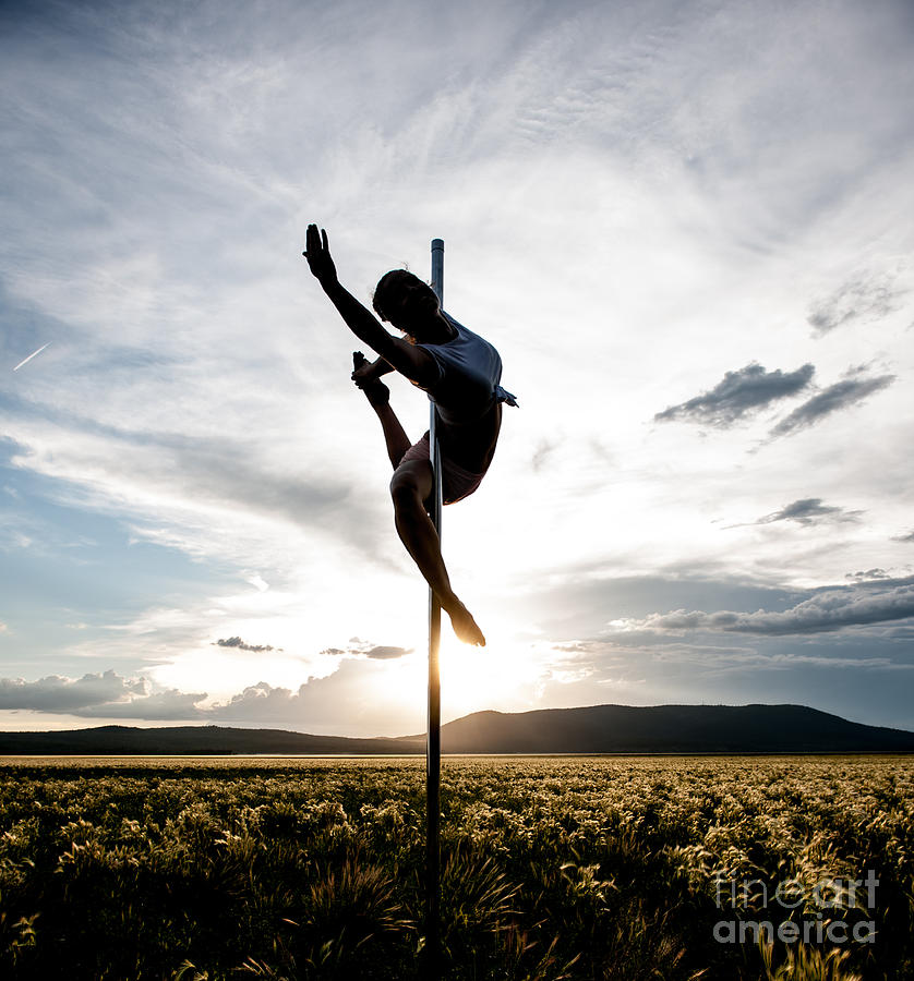 Reaching Pole Dance At Sunset Photograph