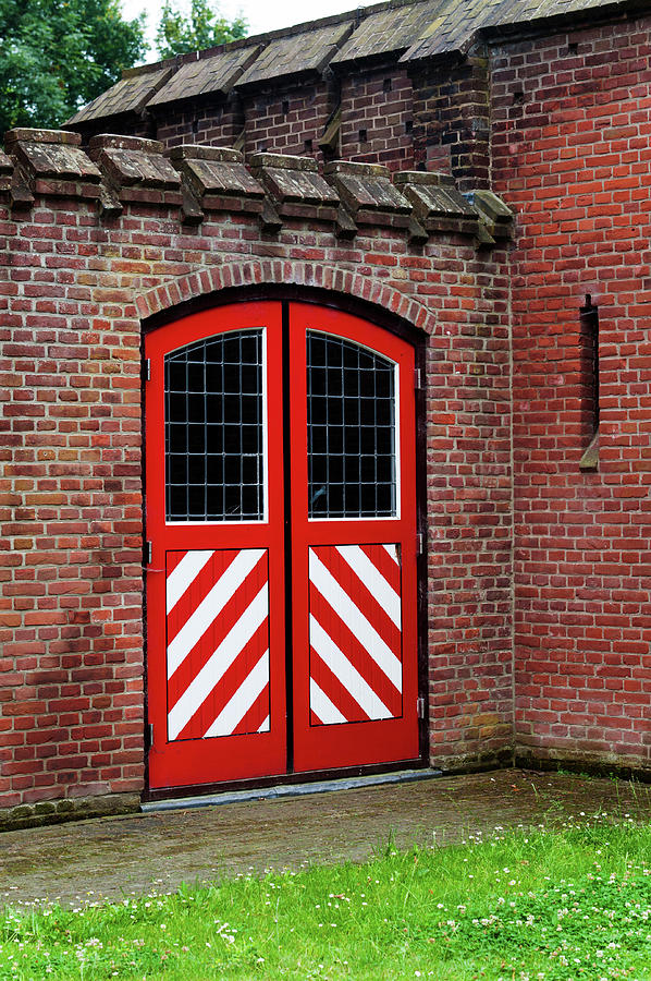Red and White Door of Outbuilding. De Haar Castle Photograph by Jenny Rainbow