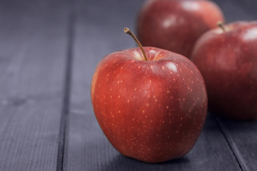 Red apples on a dark blue background Photograph by Jaroslav Frank ...