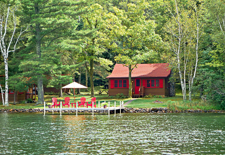 Red Chairs and a Cabin Photograph by Robert Meyers-Lussier