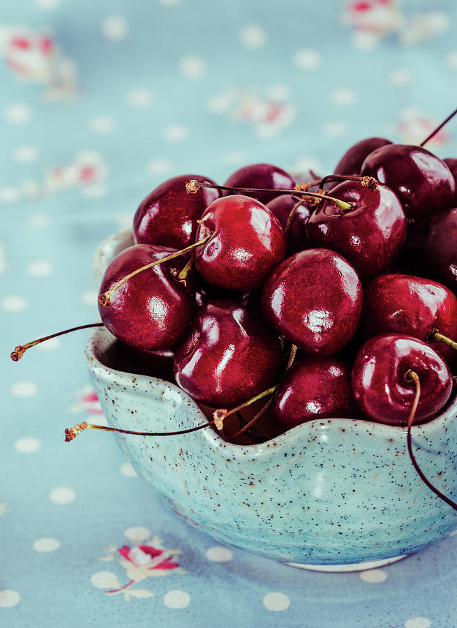 Red Cherries In Blue Ceramic Bowl Photograph by Oksana Ariskina