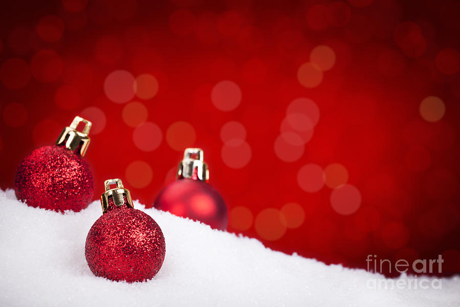 Red Christmas baubles on snow with a red background Photograph by Sara  Winter - Pixels