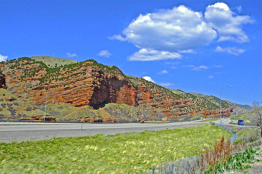 Red Cliffs and White Clouds over Interstate 80 Rest Stop in Utah  Photograph by Ruth Hager