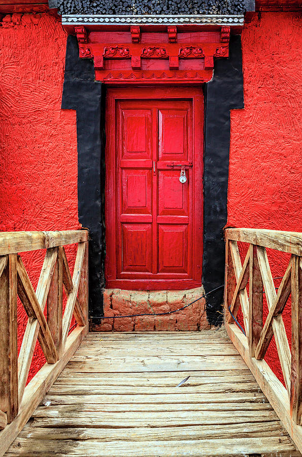 Red door at a monastery Photograph by Alexey Stiop