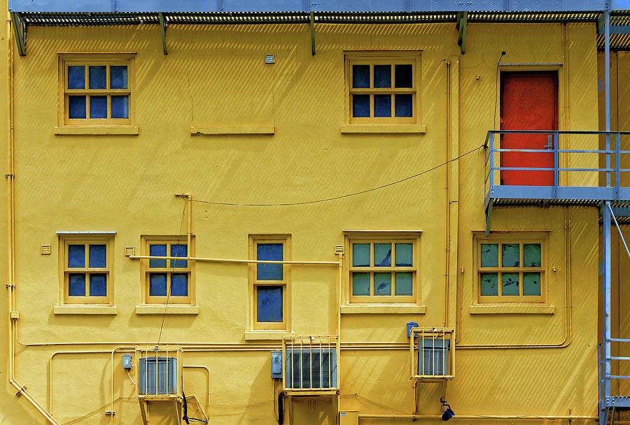 Red door on yellow Photograph by Rudy Umans