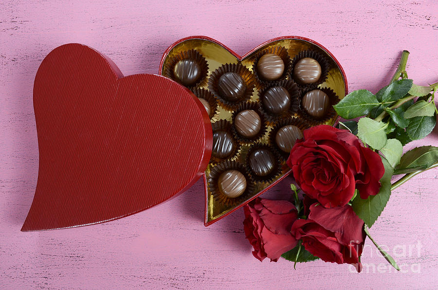 Red heart shape gift box of chocolates Photograph by Milleflore Images