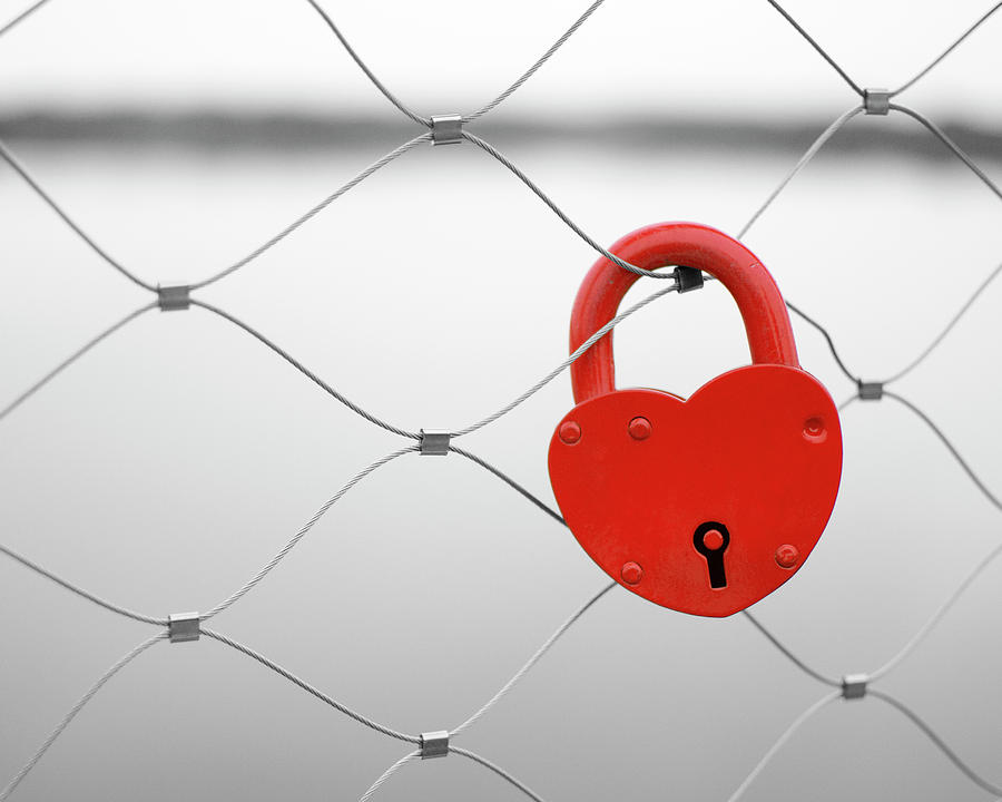 Vintage Photograph - Red heart shaped love padlock on a bridge fence by Denniro Denniro