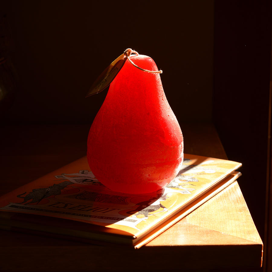 Red Pear Candle in Sunlight Photograph by Ronda Broatch