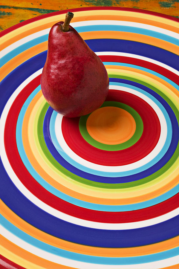 Fruit Photograph - Red pear on circle plate by Garry Gay