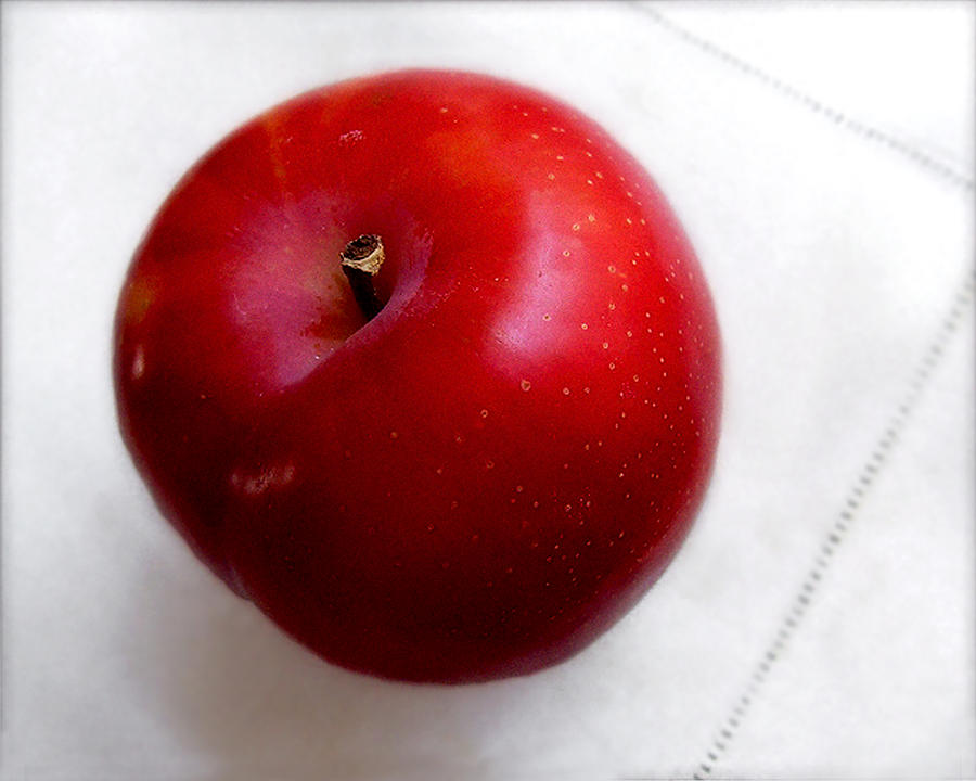 Red Plum on a White Cloth Photograph by Louise Kumpf