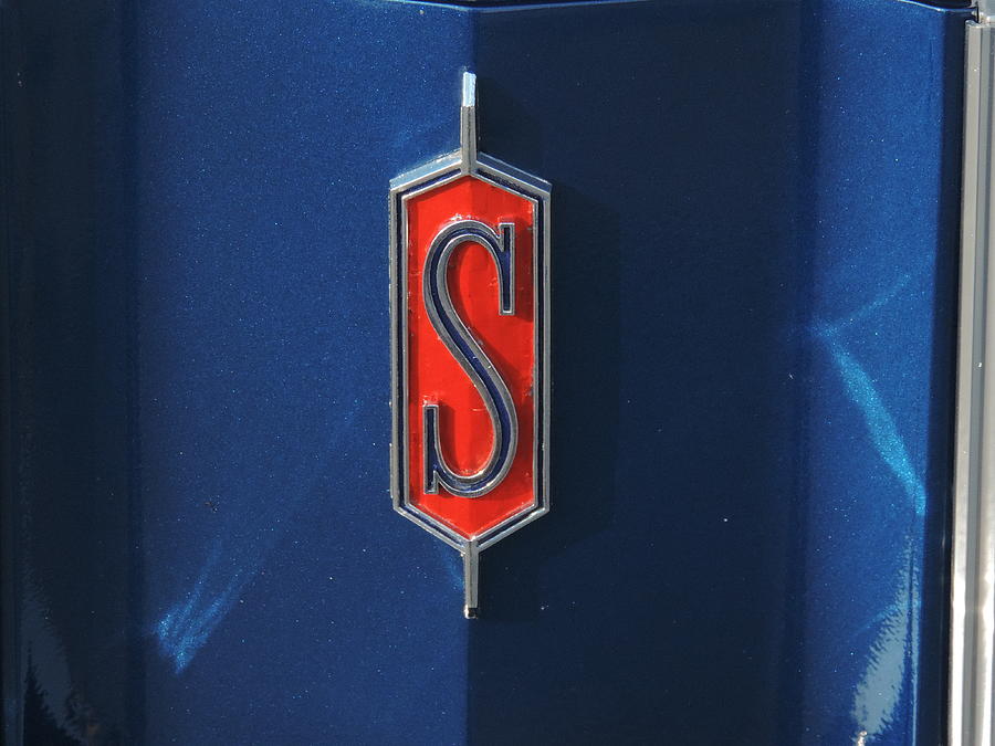 Blue S On Red Photograph by Bill Tomsa