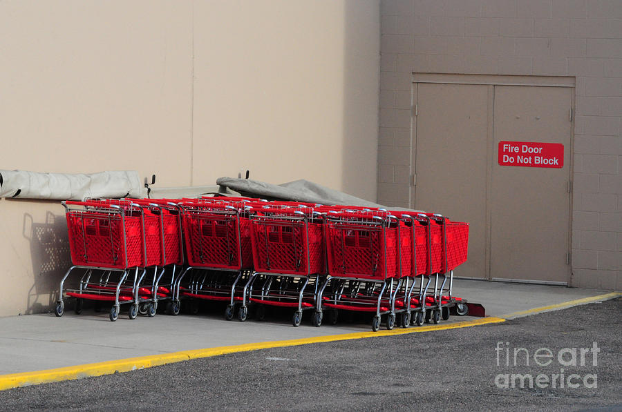 Shopping Carts Photograph - Red Shopping Carts in a row by Merrimon Crawford Shopping Carts Photograph - Red Shopping Carts in a row by Merrimon Crawford