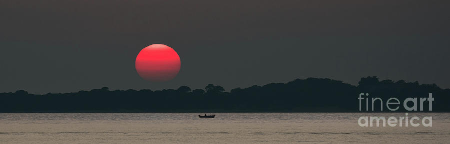Red Sun at Sunset at Sea with Fishing Boat Photograph by Andreas Berthold