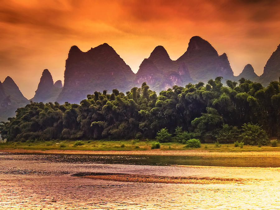 Red sunset glows-China Guilin scenery Lijiang River in Yangshuo Photograph by Artto Pan