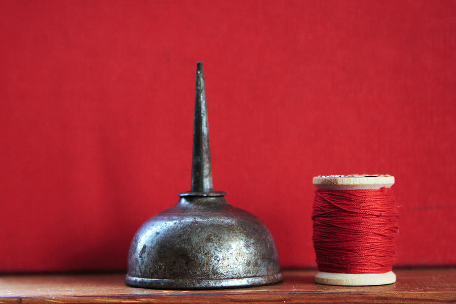 Red Thread and Oil Can Photograph by Toni Hopper
