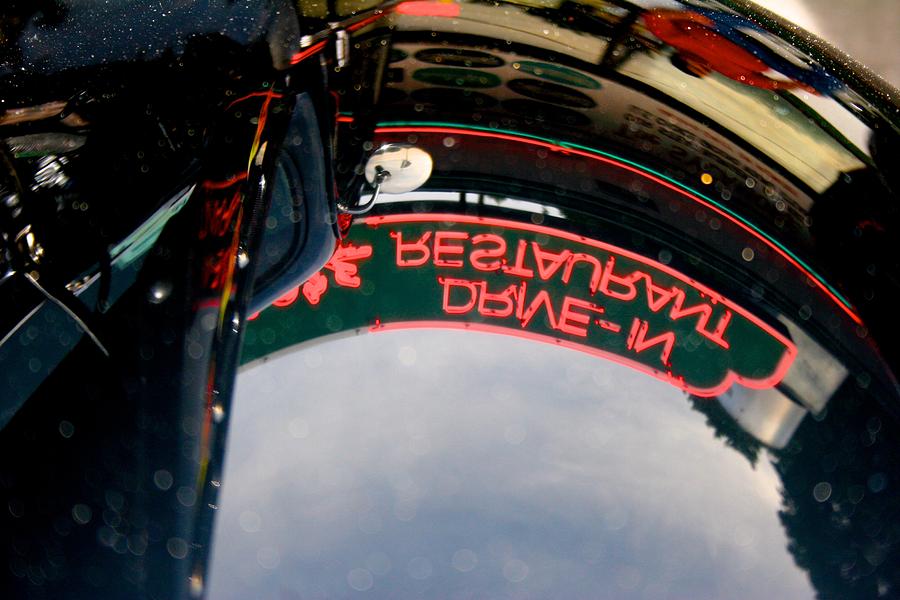 Reflected Neon Sign in Car Hood Photograph by Polly Castor