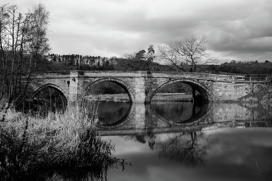 Reflecting Oval Stone Bridge in Blanc and White Photograph by Dennis Dame