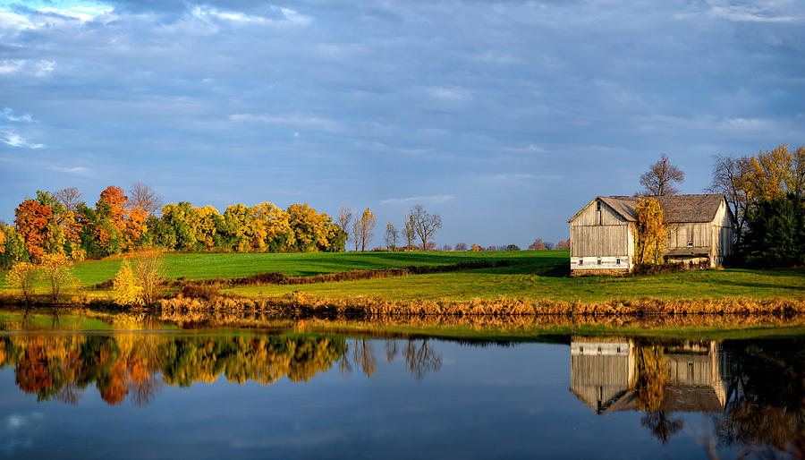 Reflection of an Autumn Barn Photograph by Matt Hammerstein