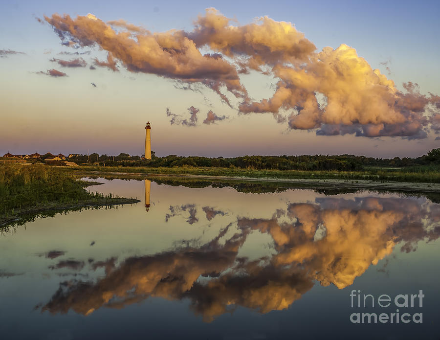 Reflection of Clouds and Lighthouse Photograph by Nick Zelinsky Jr