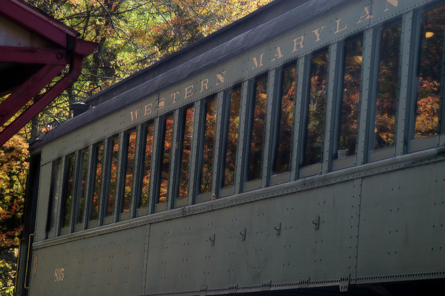 Reflection of color leaves in train windows Photograph by Dan Friend