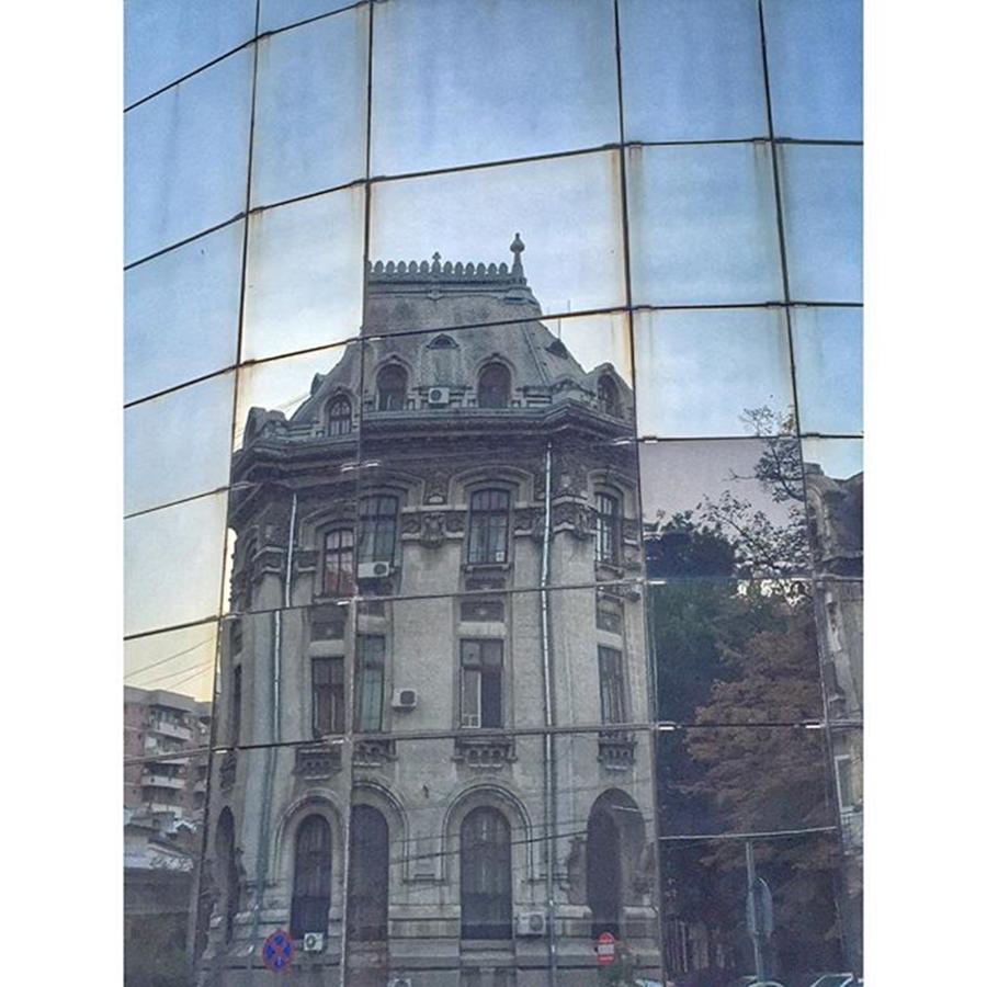 Architecture Photograph - Reflection On A Skyscraper Facade Of by Adriano La Naia