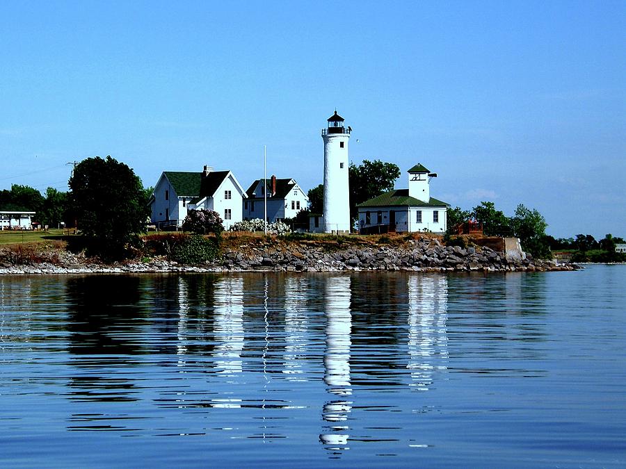 Reflections at Tibbetts Point Lighthouse Photograph by Dennis McCarthy