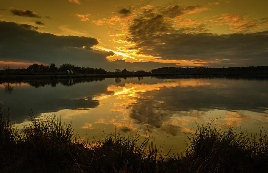 Reflections of a Sunset Photograph by Nick Bywater