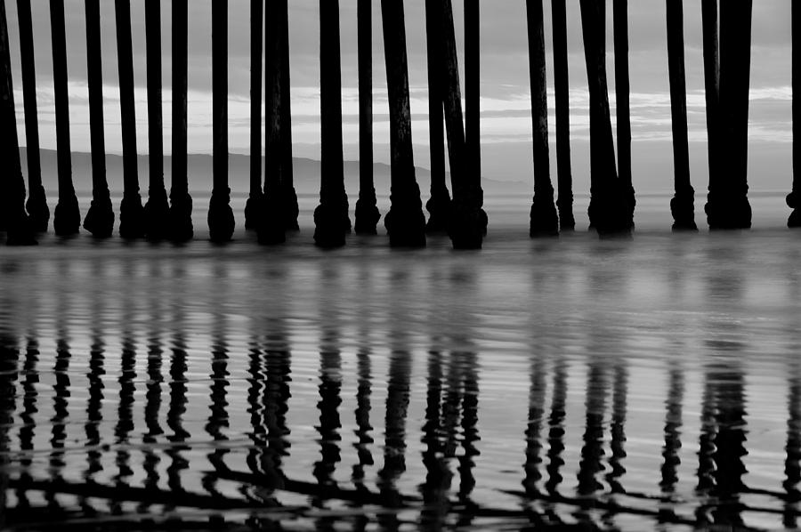 Reflections Under the Pier - Pismo Beach California BW Photograph by Gregory Ballos