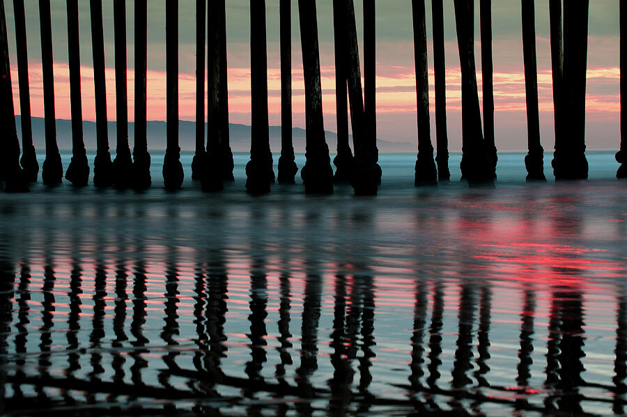 Sunset Photograph - Reflections Under the Pier - Pismo Beach California by Gregory Ballos