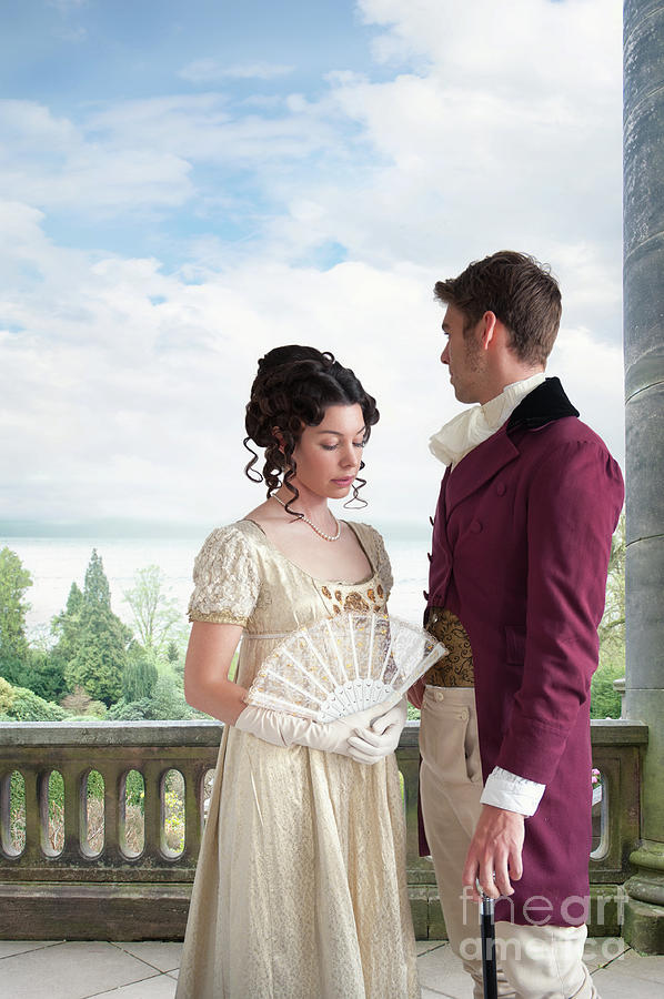 Regency Couple On A Patio Overlooking The Sea Photograph by Lee Avison